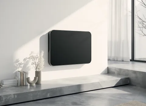 Horizontaler schwarzer Designheizkörper Relax Hybrid vom Hersteller Bemm im modernen Wohnzimmer.
